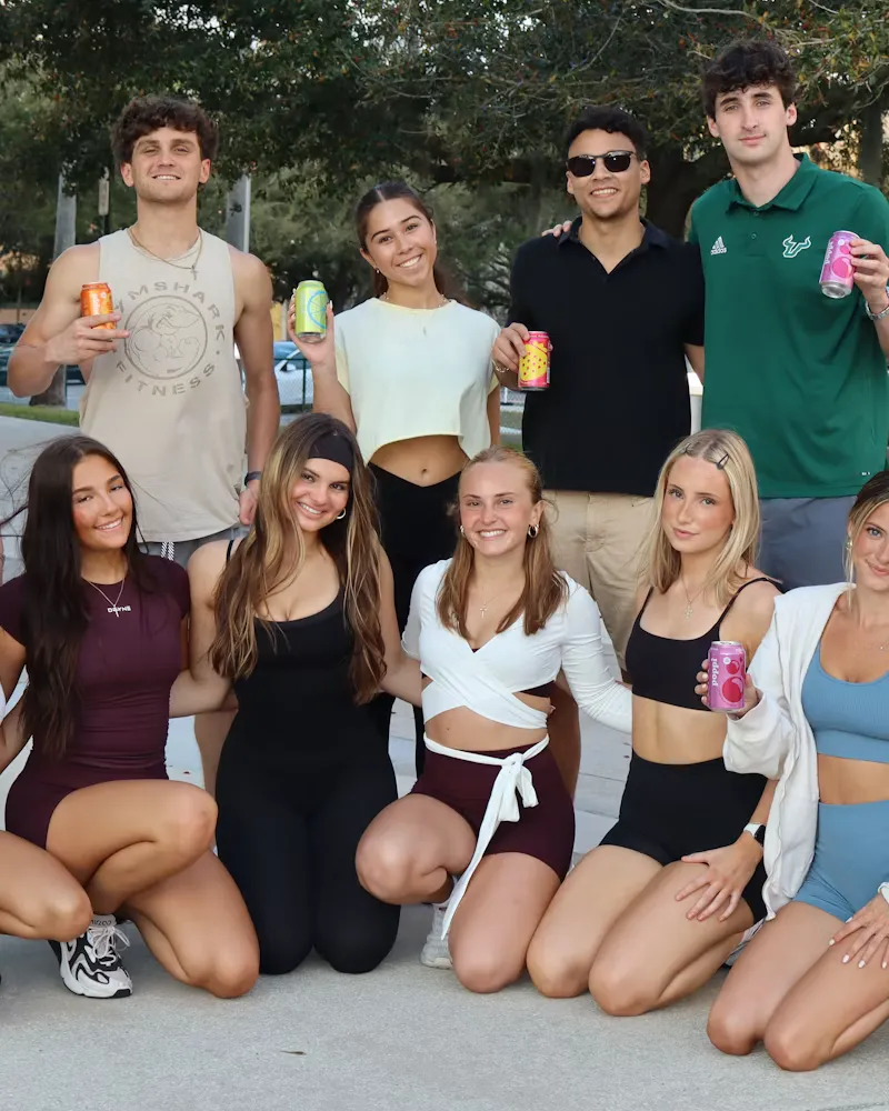 A group of guests posing at a campus event