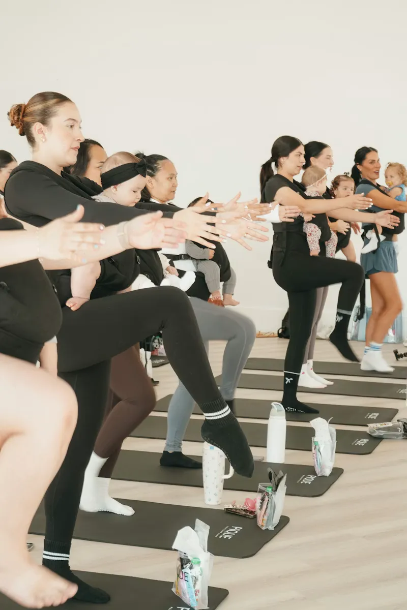 A fitness class mid-workout at a studio event