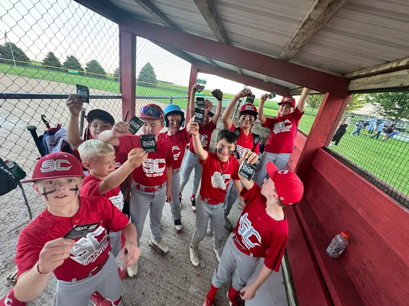 A youth sports team with drinks at a game-day event